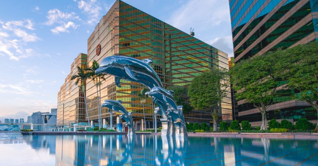 Explore a luxury resort poolside with iconic dolphin statues in Kowloon, Hong Kong.